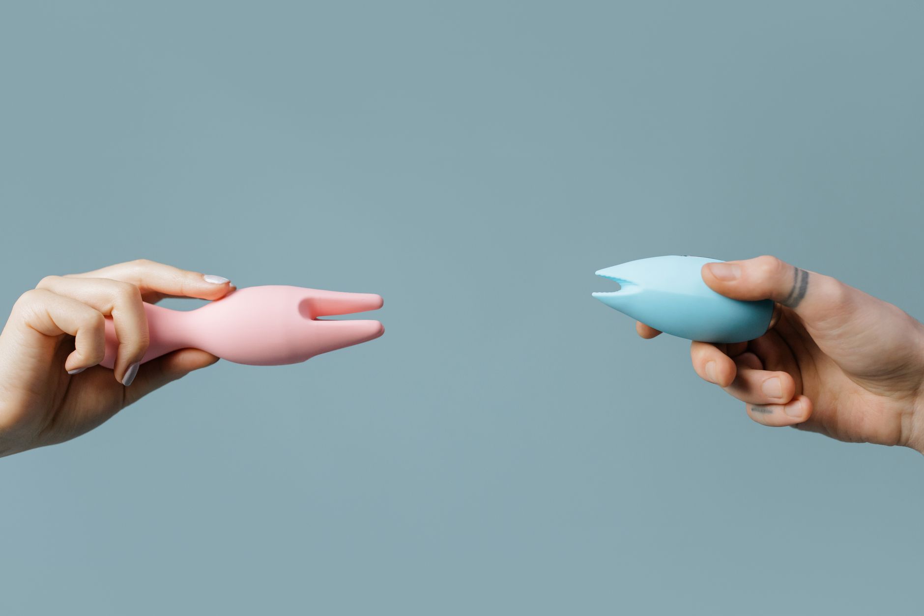 Woman holding a vibrator with confident expression