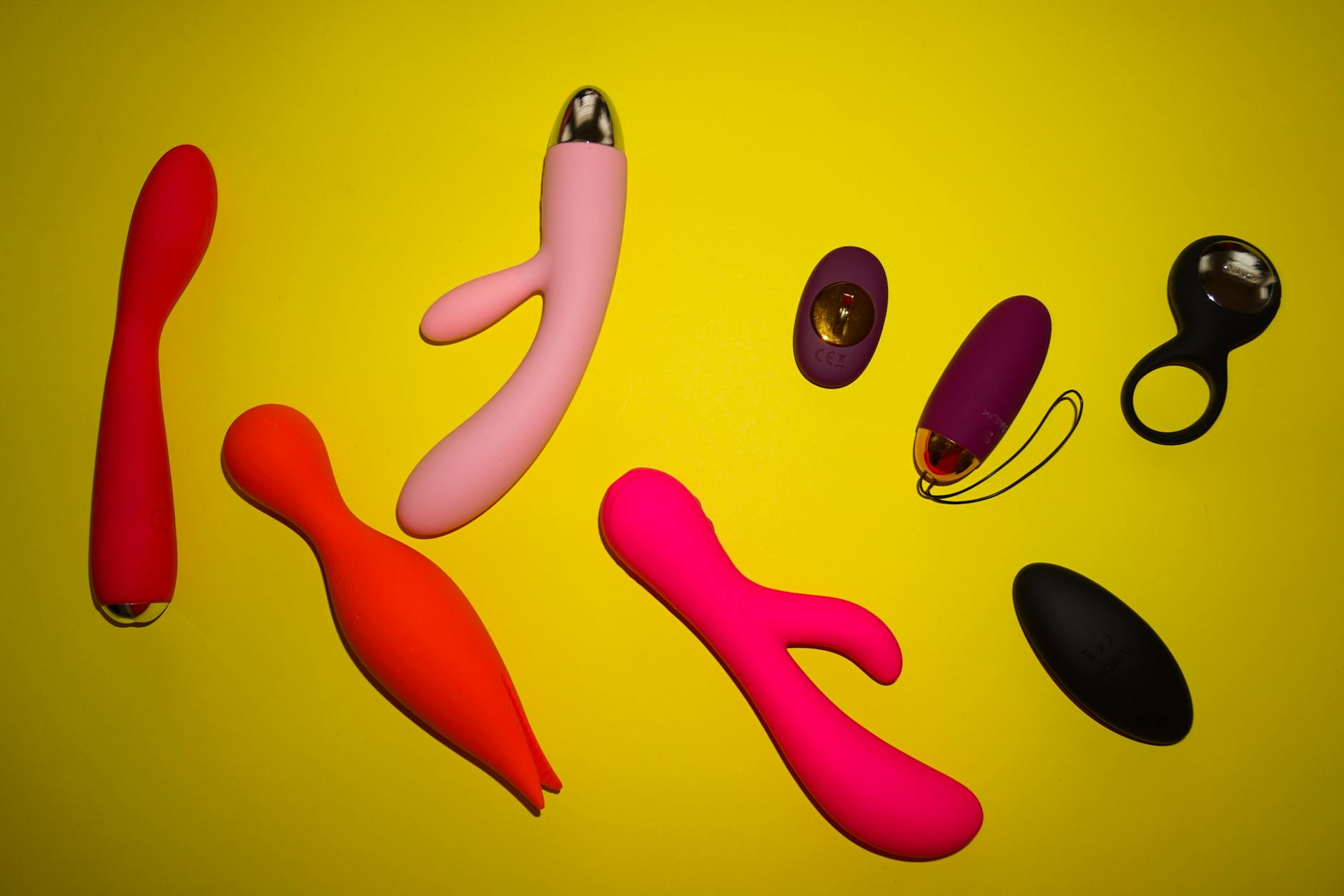 Fresh vibrant lemons on a yellow background, symbolizing the Lem vibrator's bright, efficient design